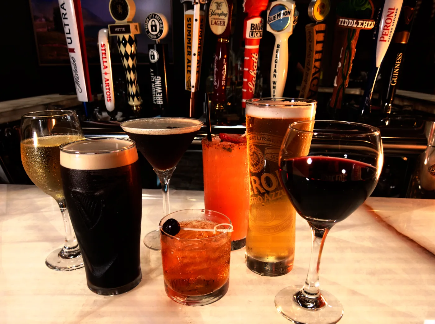 Cocktails, wine, and beer arranged at Joey's bar