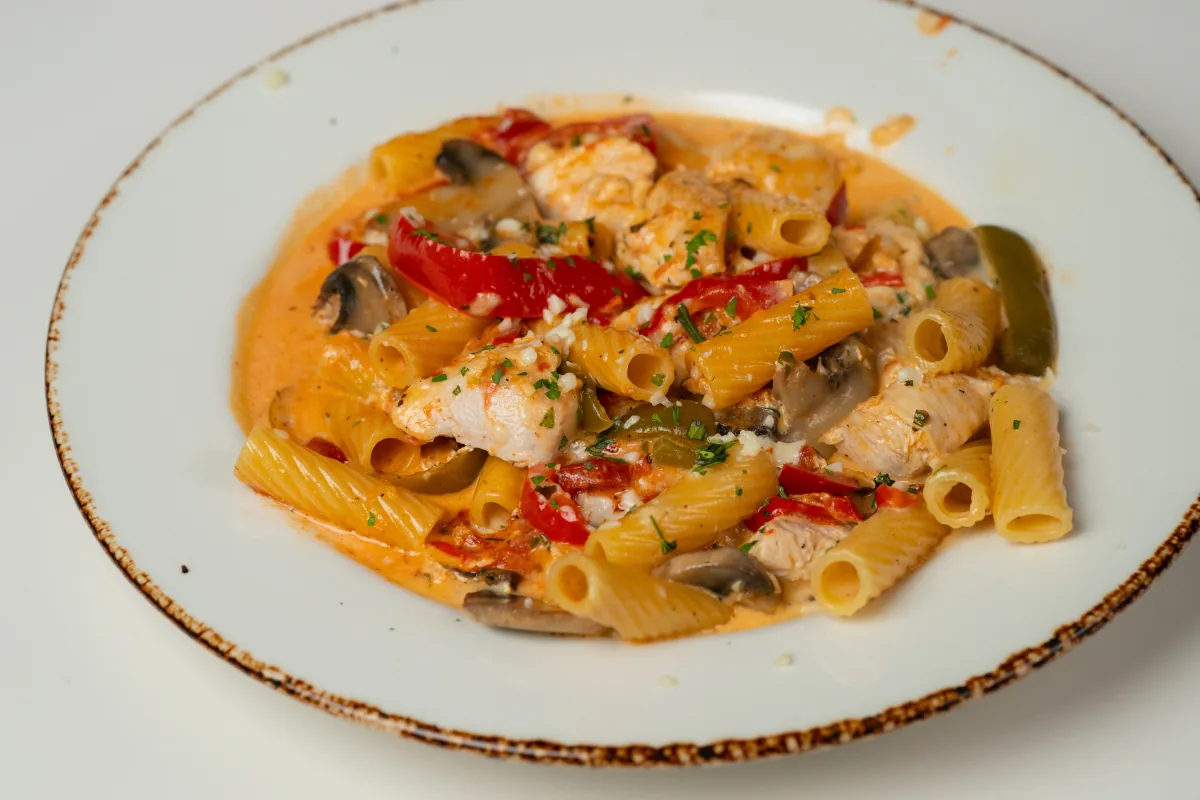 Rigatoni with chicken, peppers, mushrooms, and a creamy sauce
